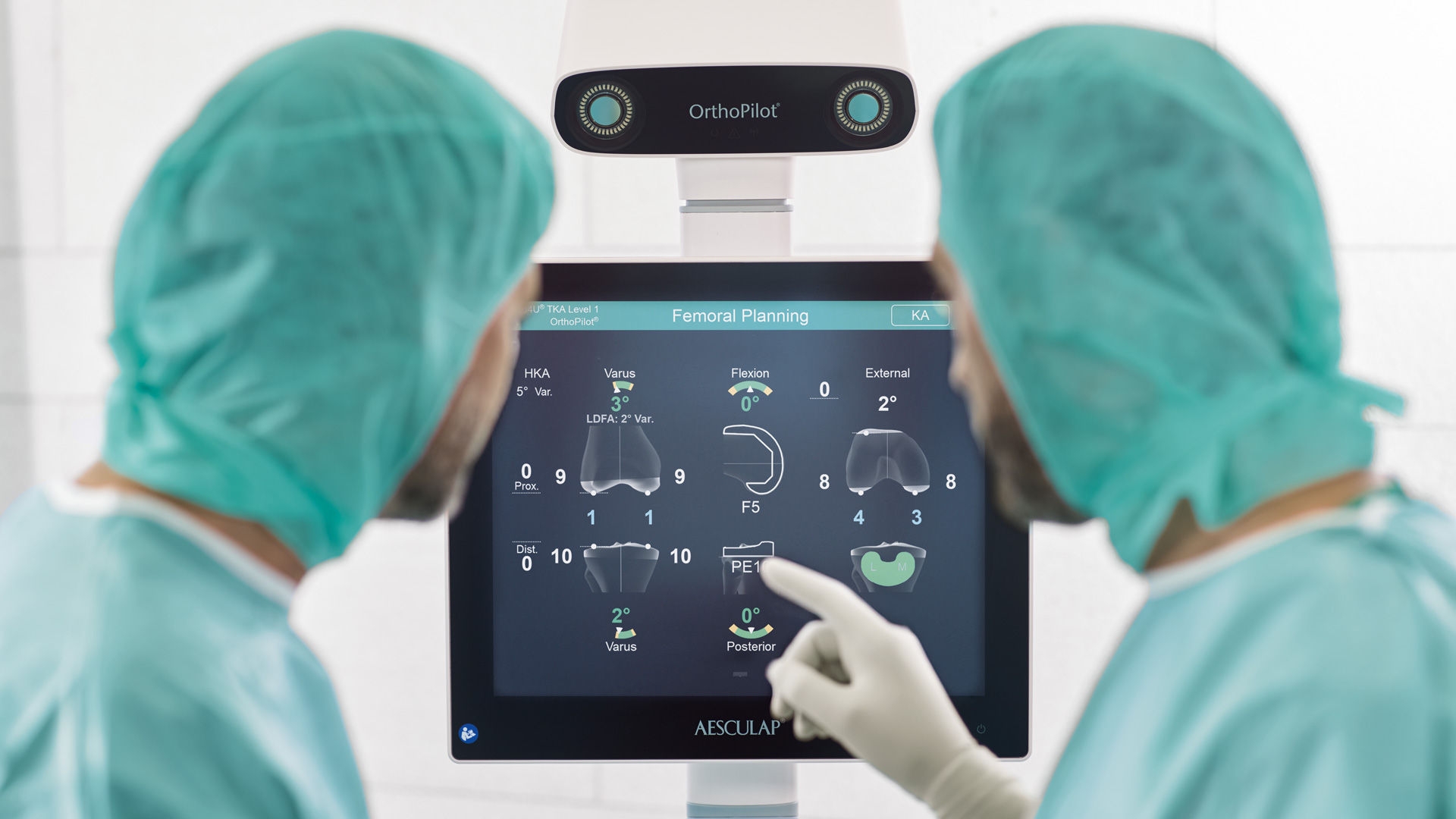 Two orthopaedic sugeons using the OrthoPilot Elite navigation system.