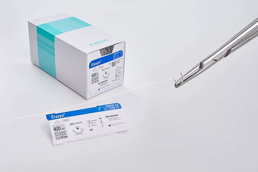 Presenting our PTFE suture material ELASYN, which is especially suitable for OMF surgery. Description of the properties of the thread, photo of the sales unit (box of 12) and packaging of the individual thread.  