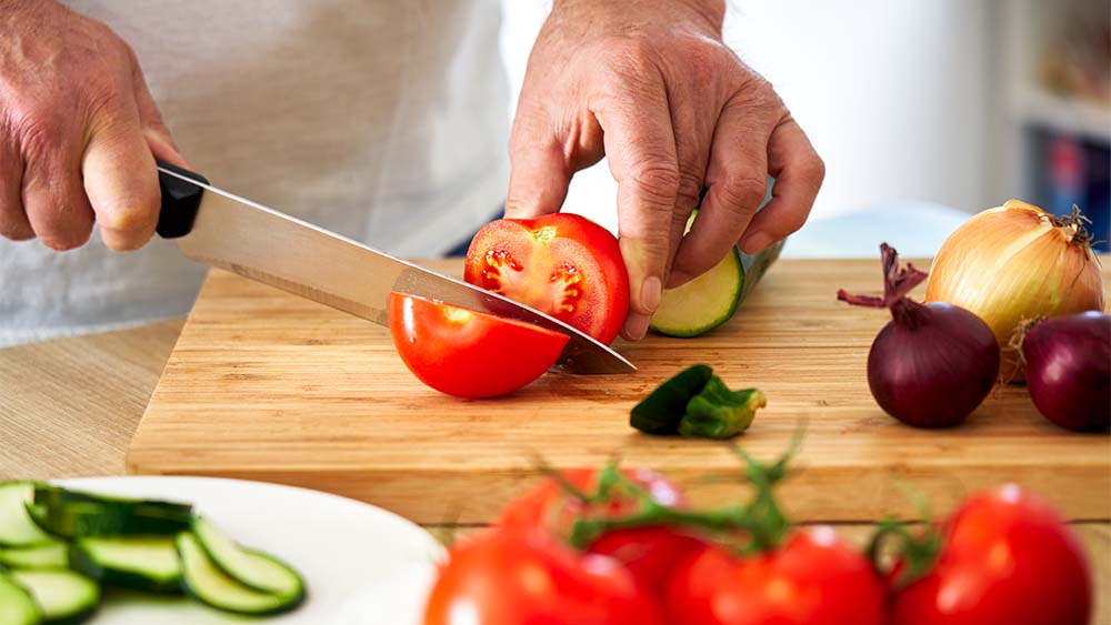 Cutting vegetables on a board